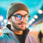 Firefly portrait of a futuristic berlin man in a beanie hat and glasses, -apocalyptic- 33518