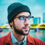 Firefly portrait of a futuristic berlin man in a beanie hat and glasses, -apocalyptic- 45141
