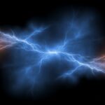 Firefly_Color splitter in dark navy blue and lightning orange flashes, black background 947757