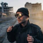 Portrait of futuristic berlin man in a beanie hat and glasses apocalyptic