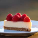 A delicous ceviche cheescake slice with strawberries on the top