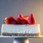 A delicous ceviche cheescake slice with strawberries on the top